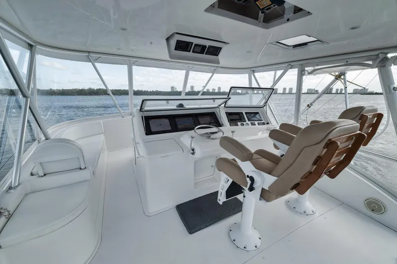 Aegis Yacht Photos Pics 2009 Viking 54 Convertible yacht helm with leather seats and panoramic water view.