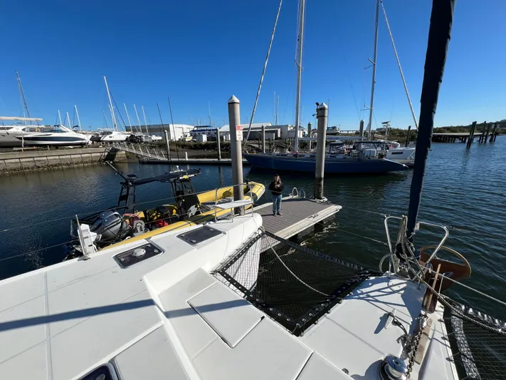 Sunbear Yacht Photos Pics 2008 Lagoon 420 catamaran docked at marina with clear blue sky.