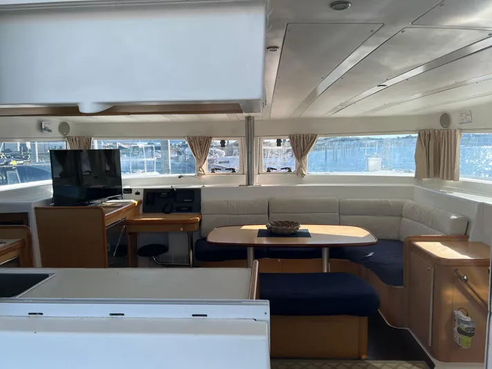Sunbear Yacht Photos Pics Interior of 2008 Lagoon 420 catamaran with seating area and TV.