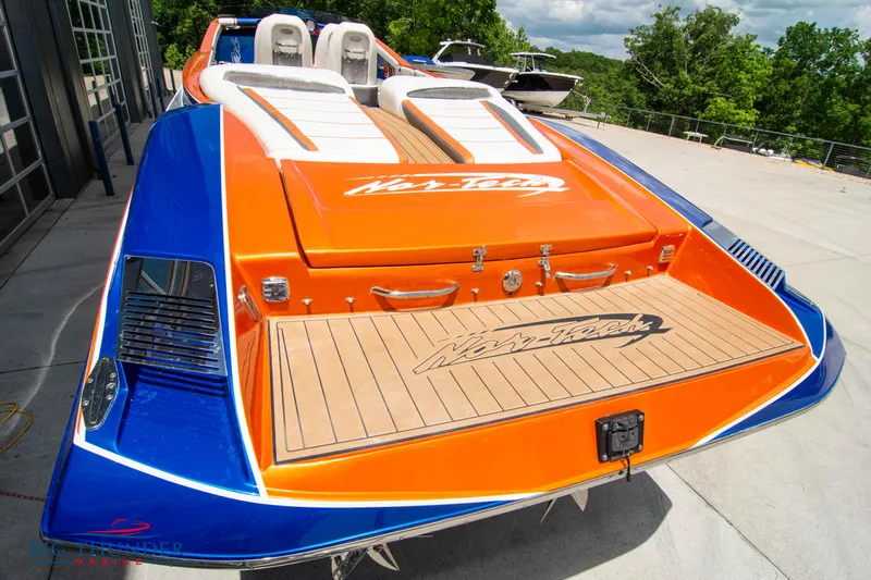  Yacht Photos Pics 2015 Nor-Tech 527 Super Vee powerboat with vibrant orange and blue design.