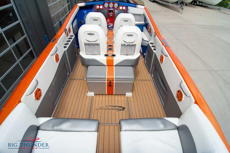  Yacht Photos Pics 2015 Nor-Tech 527 Super Vee boat interior with orange and white seating.