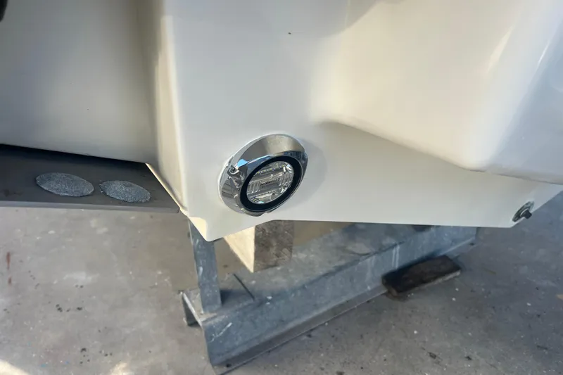  Yacht Photos Pics 2010 Pursuit C 280 Center Console boat detail with mounted light on hull.