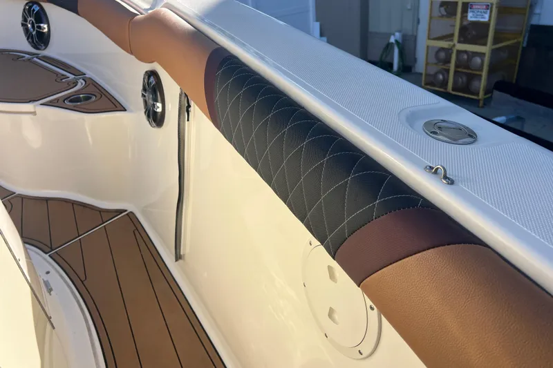  Yacht Photos Pics Interior of 2010 Pursuit C 280 Center Console boat with cushioned rail and speakers.