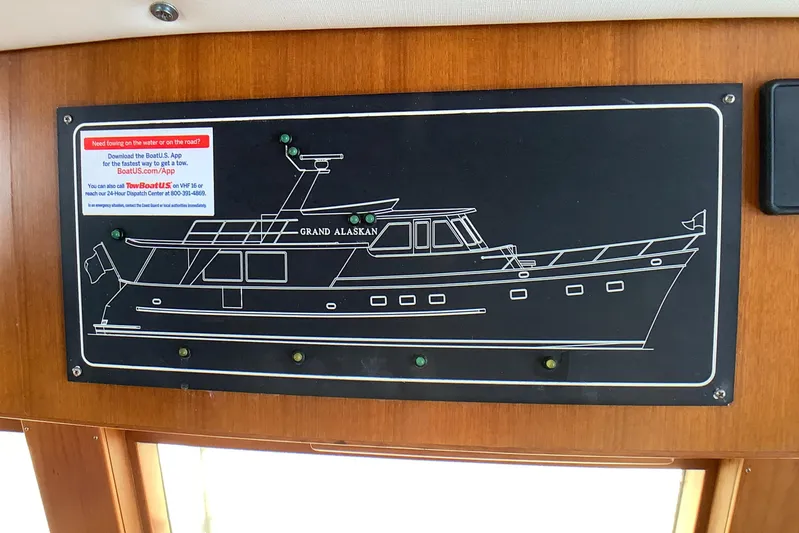El Sueno Yacht Photos Pics Diagram of a 1998 Grand Alaskan 60 Pilothouse yacht on a wooden panel.