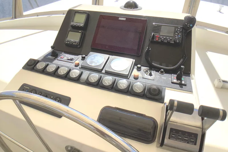 El Sueno Yacht Photos Pics Control panel of a 1998 Grand Alaskan 60 Pilothouse yacht with navigation instruments.