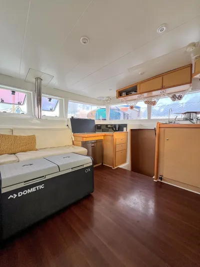 Dao And Out Yacht Photos Pics Interior of 2011 Lagoon 400 catamaran with modern furnishings and wooden flooring.