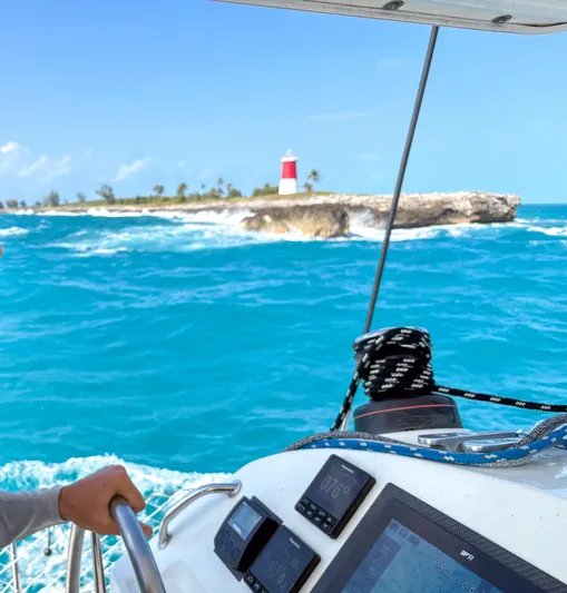 Dao And Out Yacht Photos Pics Sailing Lagoon 400 near a lighthouse on turquoise waters, 2011 model.