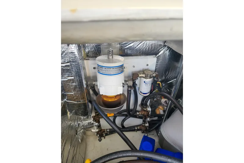 Dao And Out Yacht Photos Pics Engine compartment of 2011 Lagoon 400 with fuel filter and water separator system.