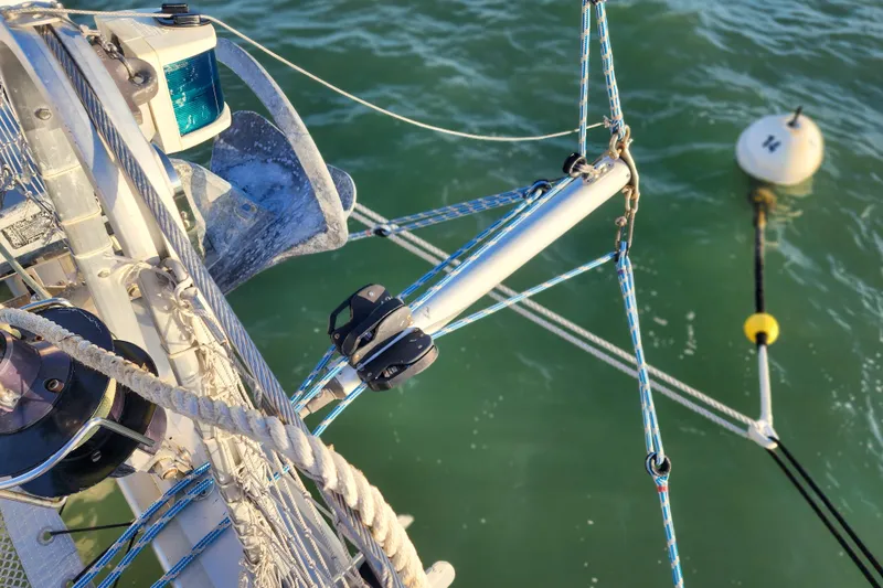 Dao And Out Yacht Photos Pics Sailboat rigging and anchor on Lagoon 400, 2011, with buoy in green water.