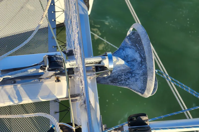 Dao And Out Yacht Photos Pics Anchor on a 2011 Lagoon 400 catamaran, secured on deck with visible ropes and netting.