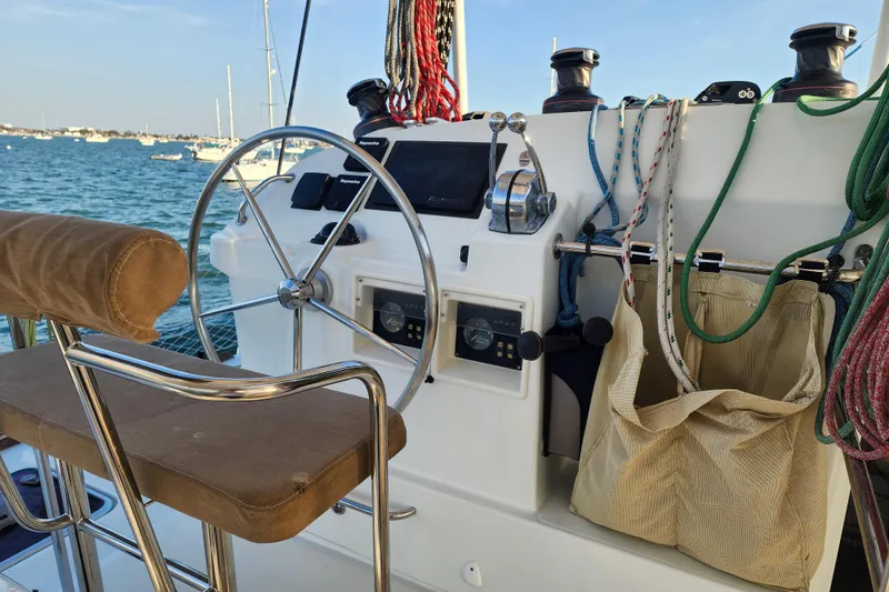 Dao And Out Yacht Photos Pics Helm of 2011 Lagoon 400 catamaran with ropes and navigation equipment.