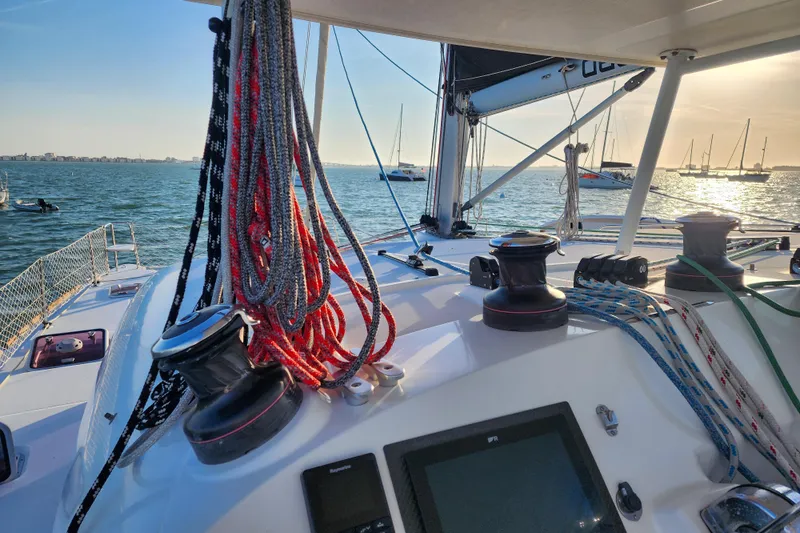 Dao And Out Yacht Photos Pics Lagoon 400 catamaran deck with ropes and winches, sailing at sunset, 2011 model.