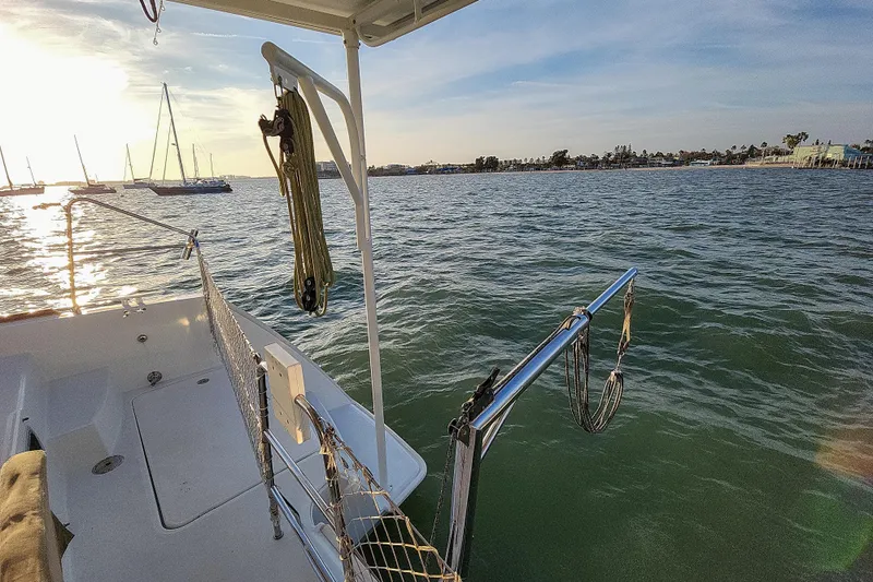 Dao And Out Yacht Photos Pics Lagoon 400 catamaran deck view, 2011 model, overlooking calm waters and distant shoreline.