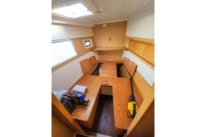 Dao And Out Yacht Photos Pics Interior of 2011 Lagoon 400 catamaran cabin with wooden furnishings and tools.