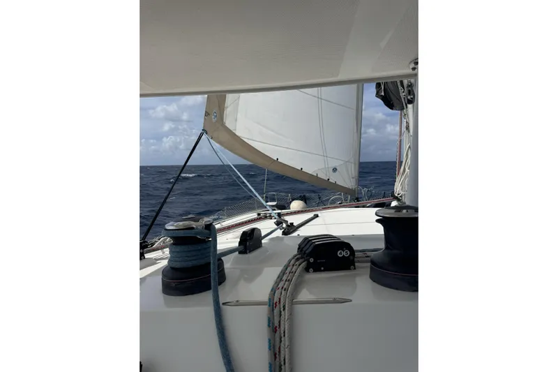 Dao And Out Yacht Photos Pics Sailing on a 2011 Lagoon 400 catamaran, open sea view with sails unfurled.