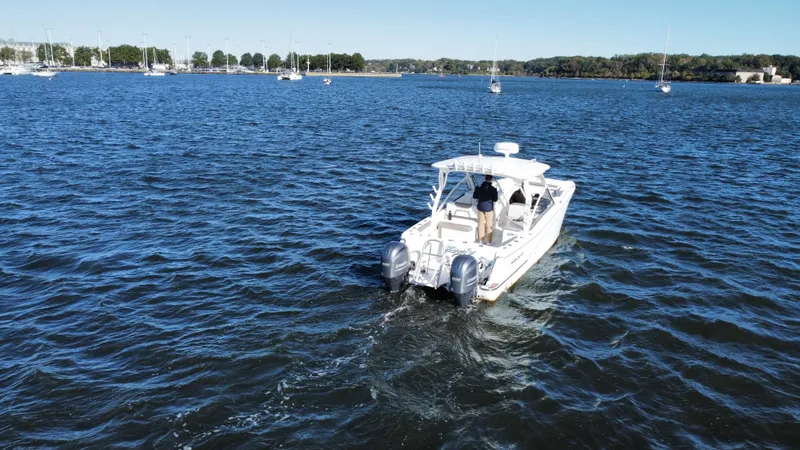 Reel'y Busy Yacht Photos Pics 2020 World Cat 280 DC x boat cruising on a calm lake.