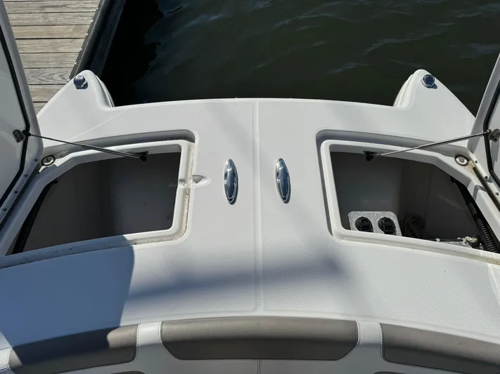 Reel'y Busy Yacht Photos Pics 2020 World Cat 280 DC x boat storage compartments open at dock.