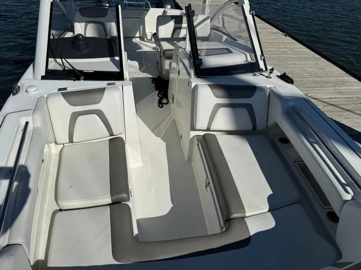 Reel'y Busy Yacht Photos Pics 2020 World Cat 280 DC x boat interior with cushioned seating and open deck.