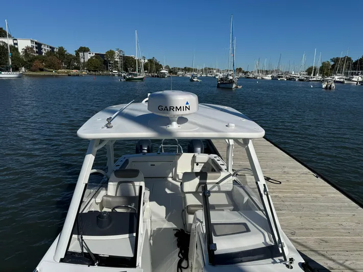 Reel'y Busy Yacht Photos Pics 2020 World Cat 280 DC x boat docked in a marina with Garmin equipment.