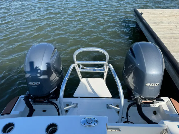 Reel'y Busy Yacht Photos Pics 2020 World Cat 280 DC x boat with twin Yamaha 200 engines at dock.