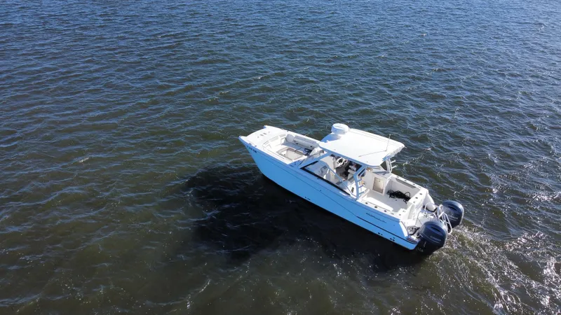 Reel'y Busy Yacht Photos Pics Aerial view of 2020 World Cat 280 DC x boat on open water.