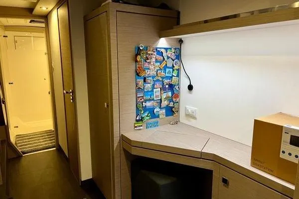Amihan Yacht Photos Pics Interior of 2023 Fountaine Pajot Isla 40 catamaran with desk and storage area.