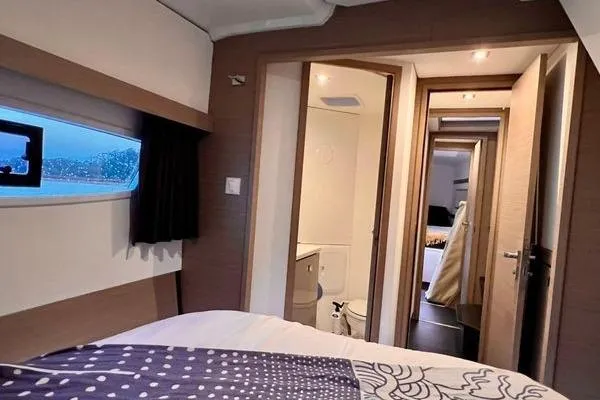 Amihan Yacht Photos Pics 2023 Fountaine Pajot Isla 40 yacht interior with cozy bedroom and modern bathroom.