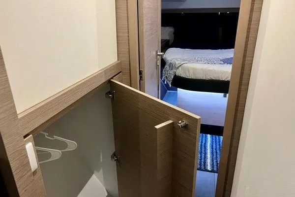 Amihan Yacht Photos Pics Interior of 2023 Fountaine Pajot Isla 40 catamaran, featuring a cozy bedroom and closet space.