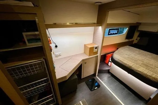 Amihan Yacht Photos Pics 2023 Fountaine Pajot Isla 40 interior cabin with modern design and cozy sleeping area.