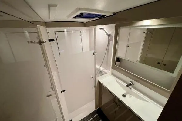 Amihan Yacht Photos Pics Modern bathroom in 2023 Fountaine Pajot Isla 40 catamaran with shower and sleek vanity.