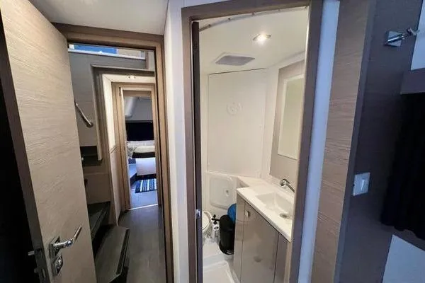 Amihan Yacht Photos Pics 2023 Fountaine Pajot Isla 40 yacht interior with modern bathroom and cozy cabin.