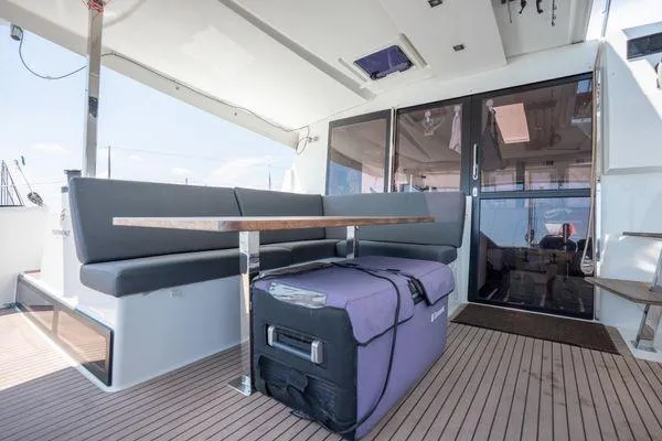 Amihan Yacht Photos Pics 2023 Fountaine Pajot Isla 40 yacht interior with seating and table on deck.