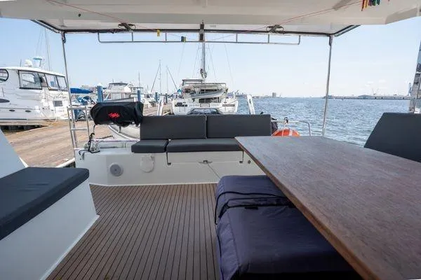 Amihan Yacht Photos Pics 2023 Fountaine Pajot Isla 40 catamaran with spacious deck and marina view.