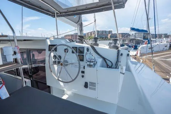 Amihan Yacht Photos Pics Helm of 2023 Fountaine Pajot Isla 40 catamaran docked at marina.