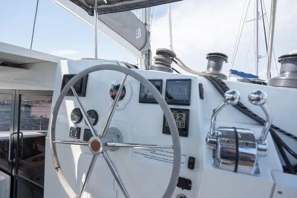 Amihan Yacht Photos Pics Helm of 2023 Fountaine Pajot Isla 40 catamaran with navigation instruments and steering wheel.