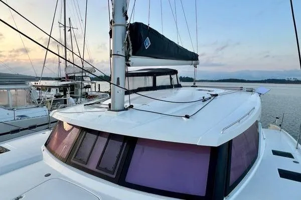 Amihan Yacht Photos Pics 2023 Fountaine Pajot Isla 40 catamaran docked at sunset, showcasing sleek design and modern features.