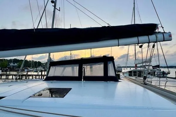 Amihan Yacht Photos Pics 2023 Fountaine Pajot Isla 40 catamaran docked at sunset, showcasing sleek design.