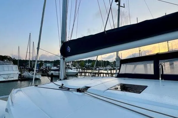 Amihan Yacht Photos Pics 2023 Fountaine Pajot Isla 40 catamaran docked at sunset, showcasing sleek design.