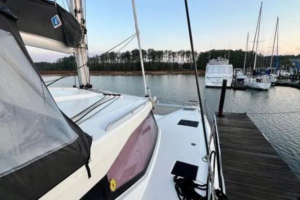 Amihan Yacht Photos Pics 2023 Fountaine Pajot Isla 40 catamaran docked at serene marina.