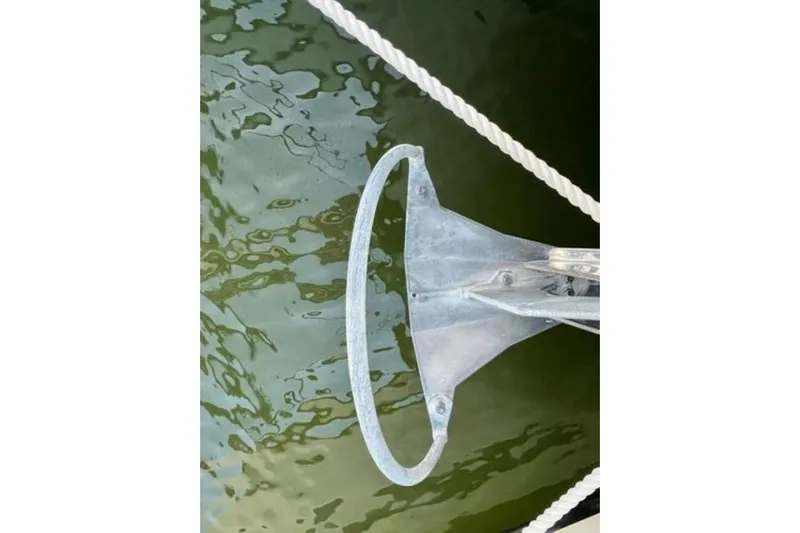 Amihan Yacht Photos Pics Anchor of 2023 Fountaine Pajot Isla 40 catamaran over water.