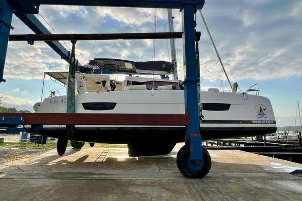 Amihan Yacht Photos Pics 2023 Fountaine Pajot Isla 40 catamaran on a lift, showcasing sleek design and modern features.