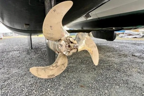 Amihan Yacht Photos Pics Propeller of 2023 Fountaine Pajot Isla 40 catamaran on gravel surface.