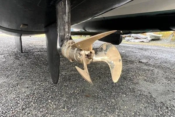 Amihan Yacht Photos Pics Propeller of 2023 Fountaine Pajot Isla 40 catamaran on gravel surface.