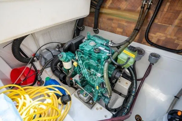 Amihan Yacht Photos Pics Engine compartment of 2023 Fountaine Pajot Isla 40 catamaran with visible wiring and components.