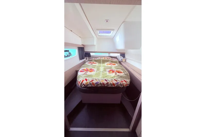 Amihan Yacht Photos Pics 2023 Fountaine Pajot Isla 40 cabin interior with colorful quilted bedspread.