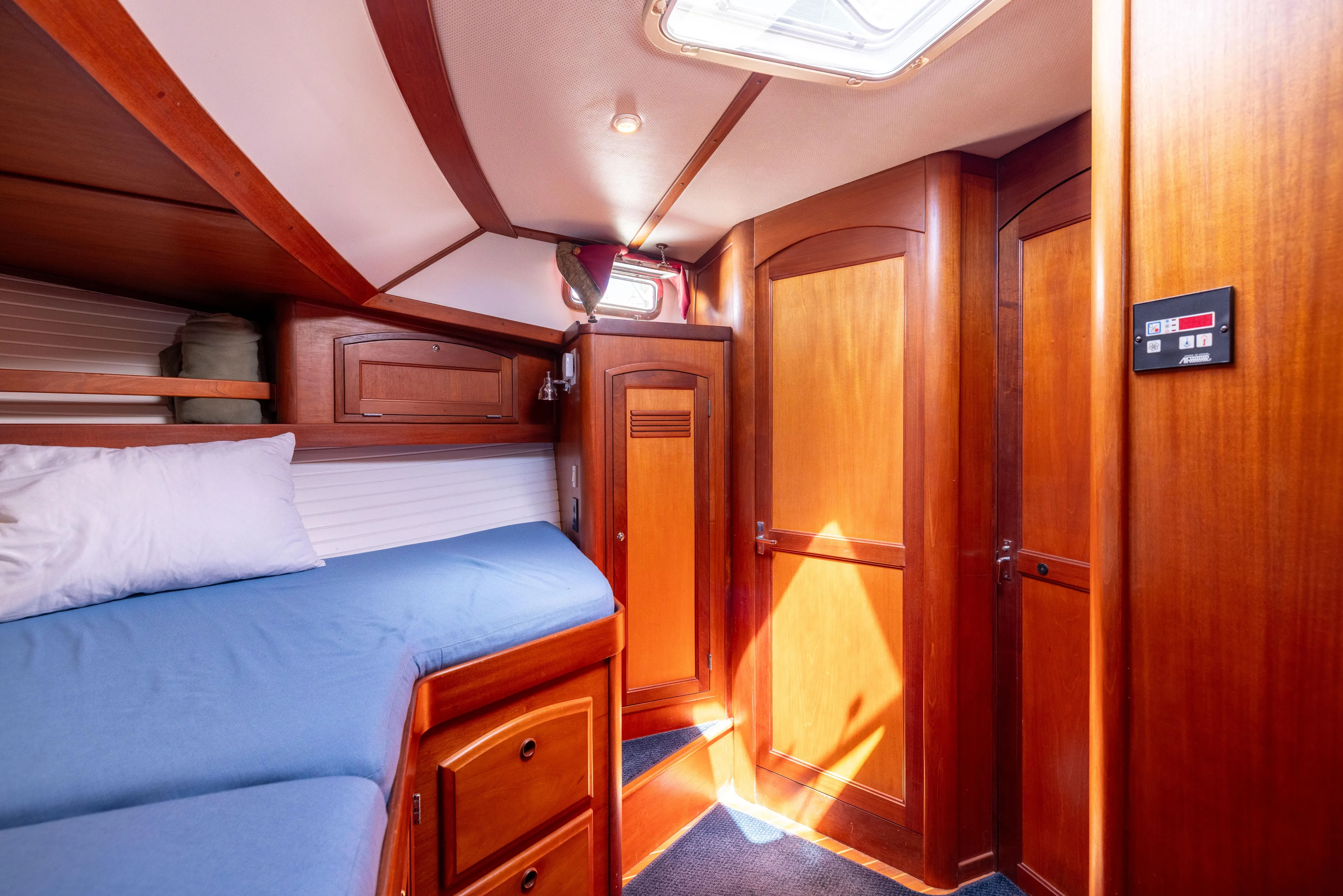Nellie Yacht Photos Pics Cozy cabin interior of 1998 Sabreline 47 Aft Cabin Trawler with wooden finish.