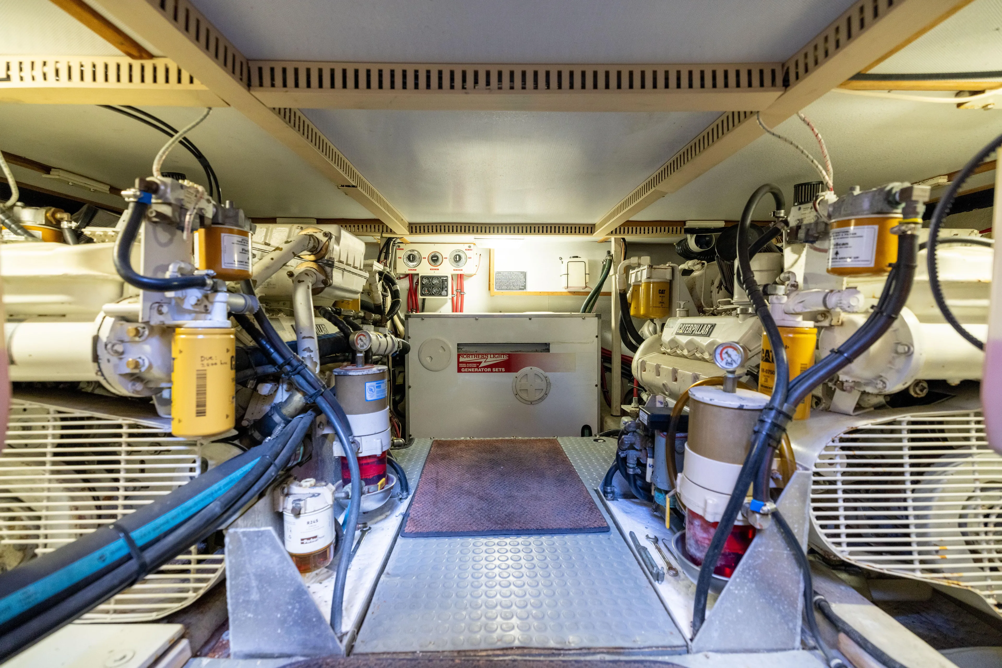 Nellie Yacht Photos Pics Engine room of 1998 Sabreline 47 Aft Cabin Trawler, showcasing mechanical components and systems.