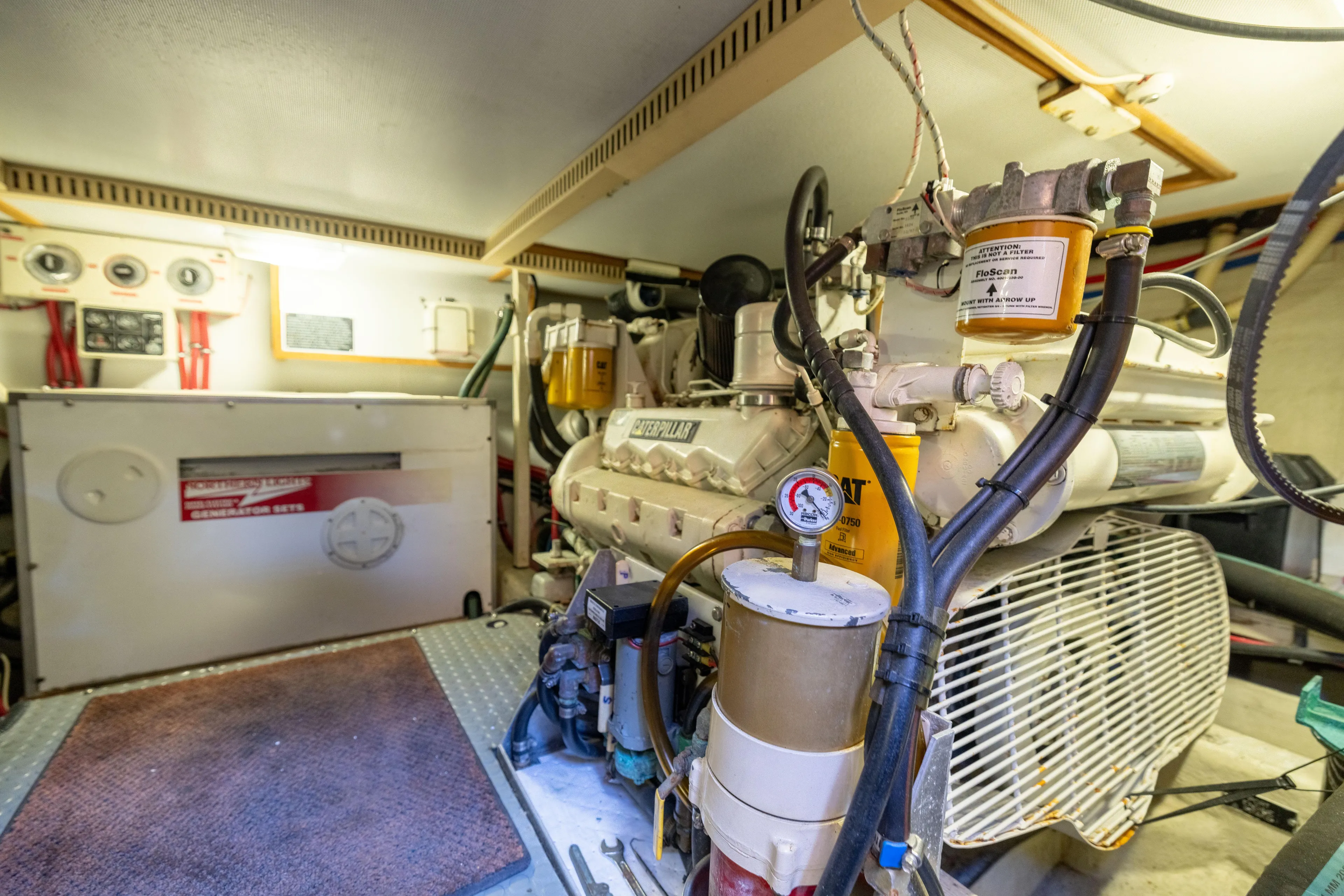 Nellie Yacht Photos Pics Engine room of 1998 Sabreline 47 Aft Cabin Trawler, showcasing mechanical components and equipment.