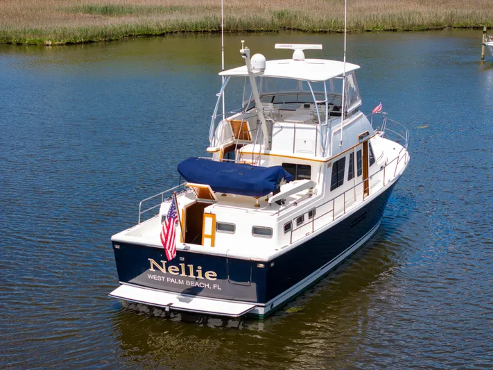 Nellie Yacht Photos Pics 1998 Sabreline 47 Aft Cabin Trawler on water, named "Nellie," West Palm Beach, FL.
