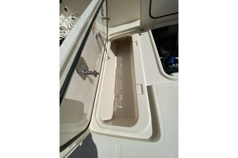  Yacht Photos Pics Open storage compartment on a 2014 Pursuit OS 345 Offshore boat.